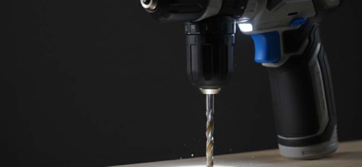 Cordless drill with bright LED light illuminating a woodworking drill point for precision accuracy
