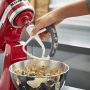KitchenAid KFE5T Flex Edge Beater attached to a stand mixer, ideal for efficient home baking.