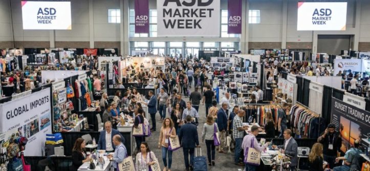 Busy wholesale trade show floor with exhibitor booths and retail buyers at ASD Market Week Las Vegas