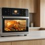 Smart air fryer oven roasting a whole chicken on a kitchen counter.