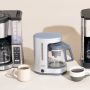 Compact coffee maker placed on a small apartment kitchen countertop