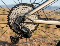 Mountain bike drivetrain inspection on rocky trail