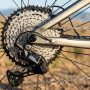Mountain bike drivetrain inspection on rocky trail