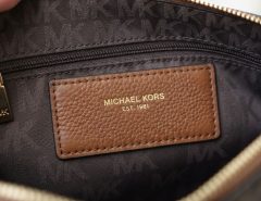 Checking Michael Kors purse logo and hardware