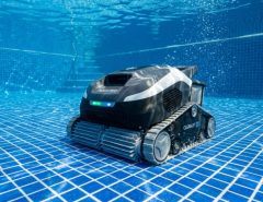 Aiper Scuba V3 cordless pool cleaner scrubbing a residential swimming pool floor.