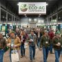 Farmers walking through the trade show hall at an Eco-Ag conference in Iowa